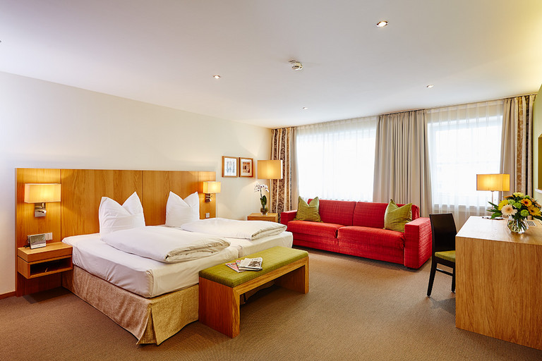 Spacious three-bed room for families at the four-star Hotel Falken