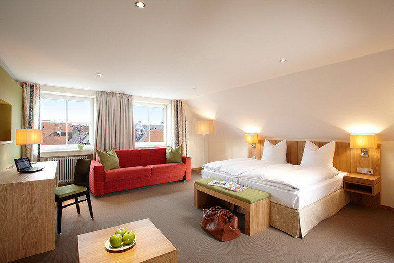Discover the spacious three-bed room at Hotel Falken